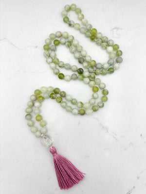 serpentine jade gemstone mala with melon shaped carved glass guru bead and pink tassel | radiant malas  handmade in boulder, colorado