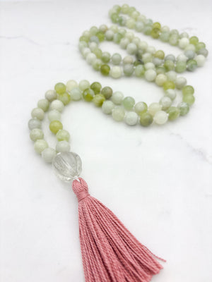 serpentine jade gemstone mala with melon shaped carved glass guru bead and pink tassel | radiant malas  handmade in boulder, colorado