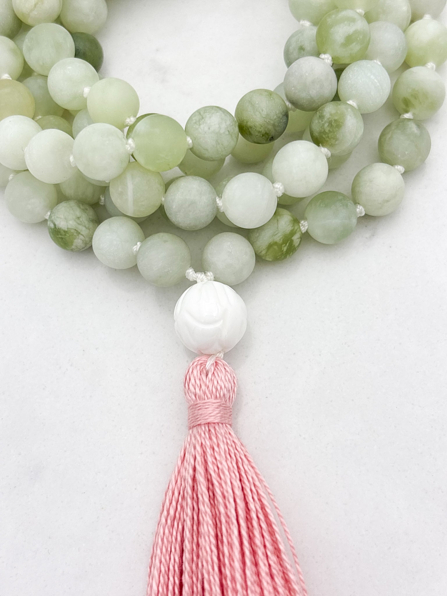 serpentine jade gemstone mala with tridacna shell guru bead and pink tassel | radiant malas  handmade in boulder, colorado