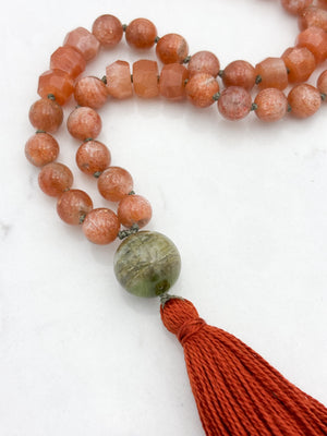 sunstone gemstone mala with cat's eye tourmaline guru bead and rust tassel | radiant malas | handmade in boulder, colorado