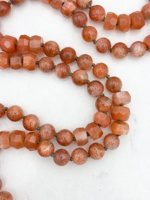 sunstone gemstone mala with cat's eye tourmaline guru bead and rust tassel | radiant malas | handmade in boulder, colorado