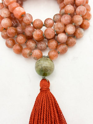 sunstone gemstone mala with cat's eye tourmaline guru bead and rust tassel | radiant malas | handmade in boulder, colorado