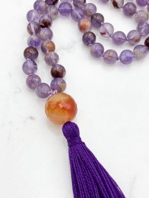 super 7 gemstone mala with carnelian guru bead and purple tassel | radiant malas | handmade in boulder, colorado