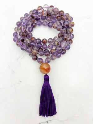super 7 gemstone mala with carnelian guru bead and purple tassel | radiant malas | handmade in boulder, colorado