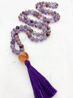 super 7 gemstone mala with carnelian guru bead and purple tassel | radiant malas | handmade in boulder, colorado