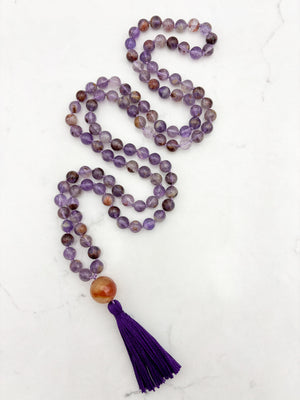 super 7 gemstone mala with carnelian guru bead and purple tassel | radiant malas | handmade in boulder, colorado
