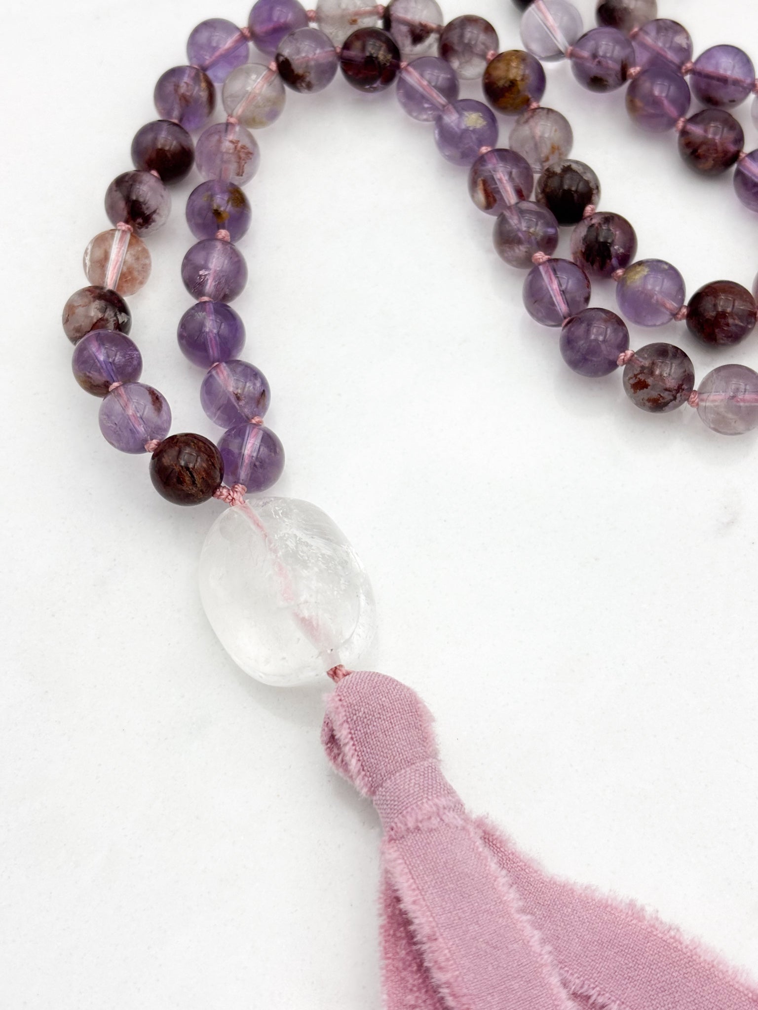 super 7 gemstone mala with clear quartz guru bead and pink silk tassel | radiant malas | handmade in boulder, colorado