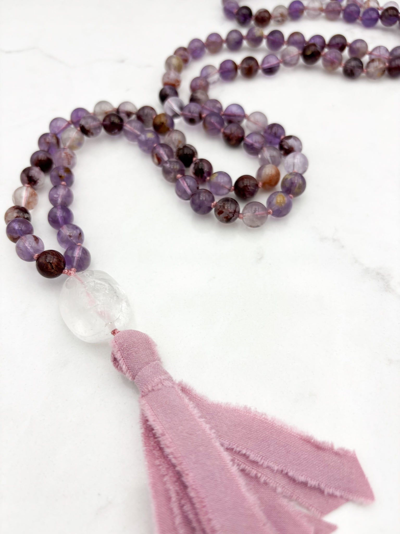 super 7 gemstone mala with clear quartz guru bead and pink silk tassel | radiant malas | handmade in boulder, colorado
