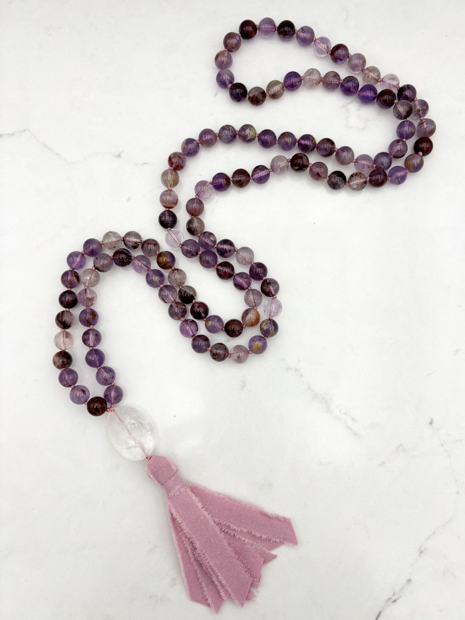 super 7 gemstone mala with clear quartz guru bead and pink silk tassel | radiant malas | handmade in boulder, colorado