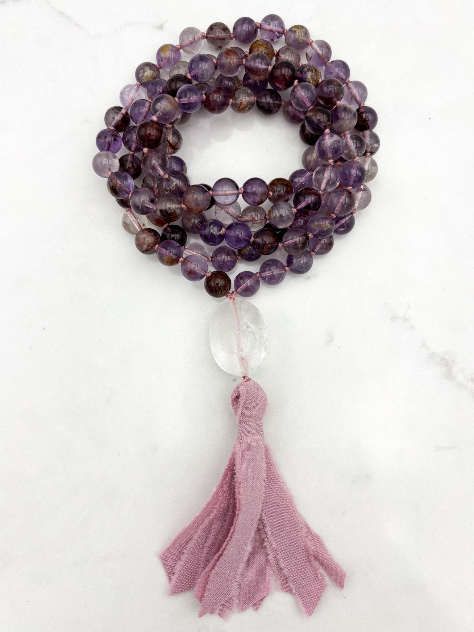 super 7 gemstone mala with clear quartz guru bead and pink silk tassel | radiant malas | handmade in boulder, colorado
