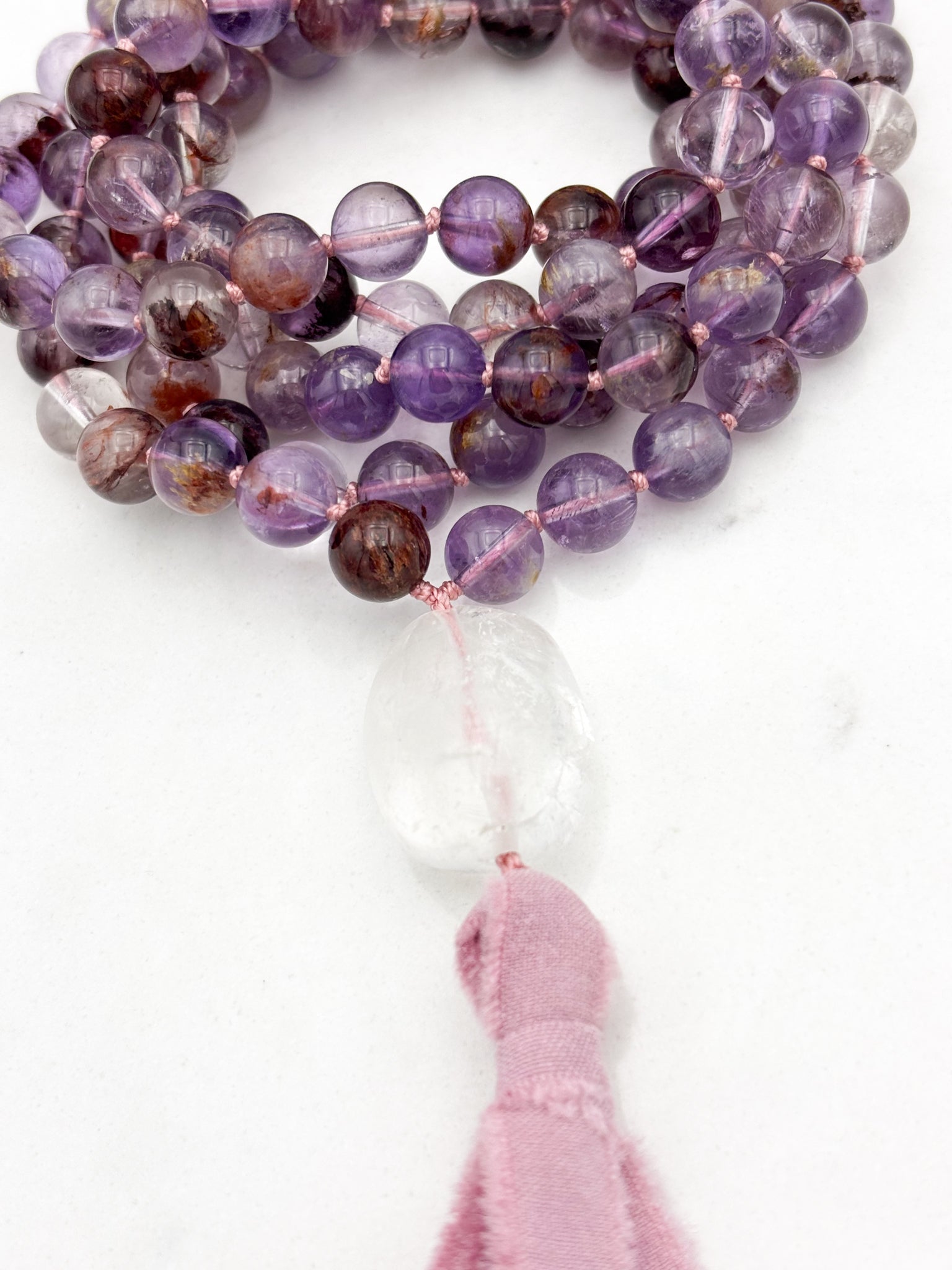 super 7 gemstone mala with clear quartz guru bead and pink silk tassel | radiant malas | handmade in boulder, colorado