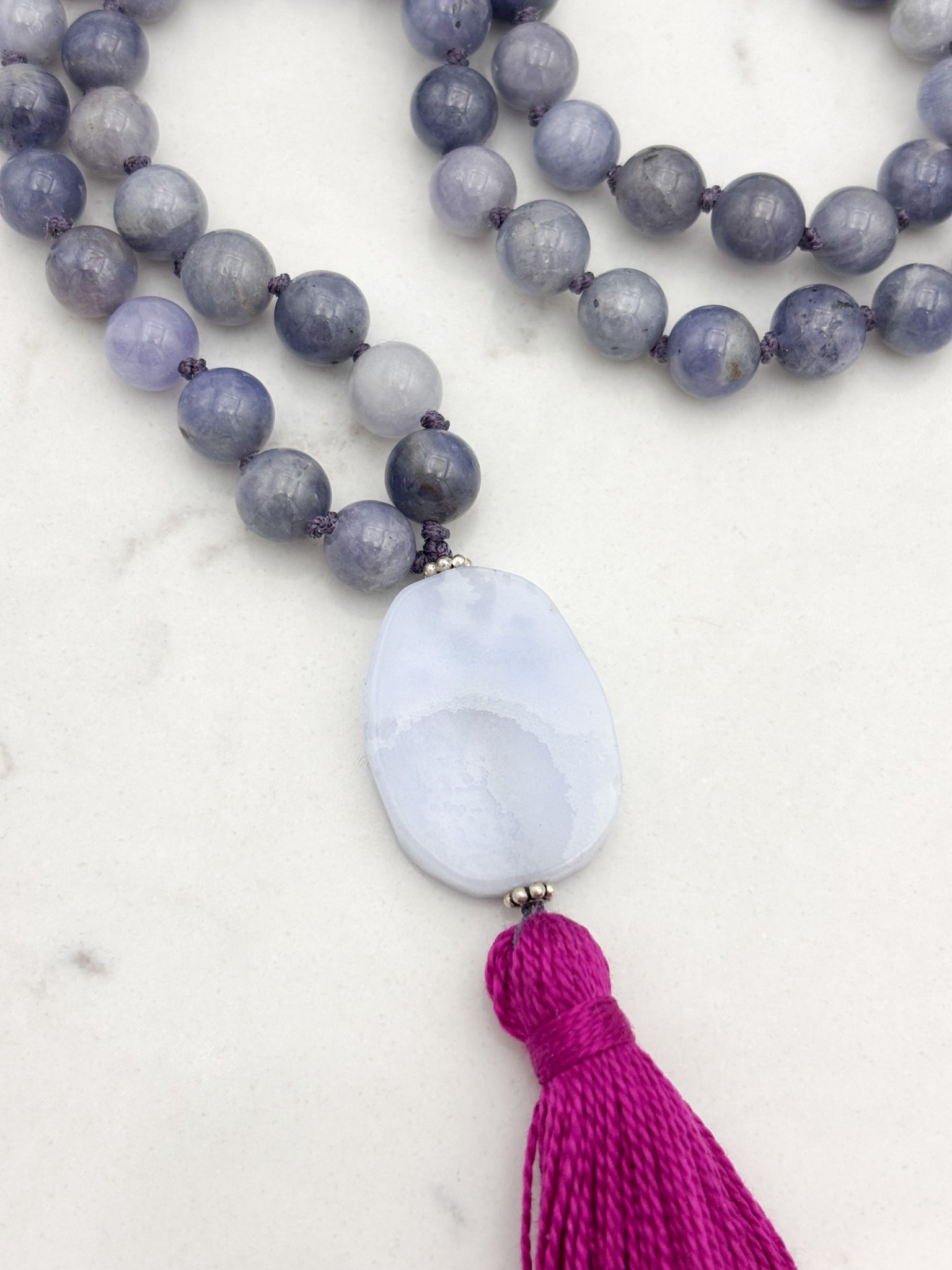tanzanite gemstone mala necklace with blue lace agate guru bead and hot pink tassel | radiant malas | handmade in boulder, colorado