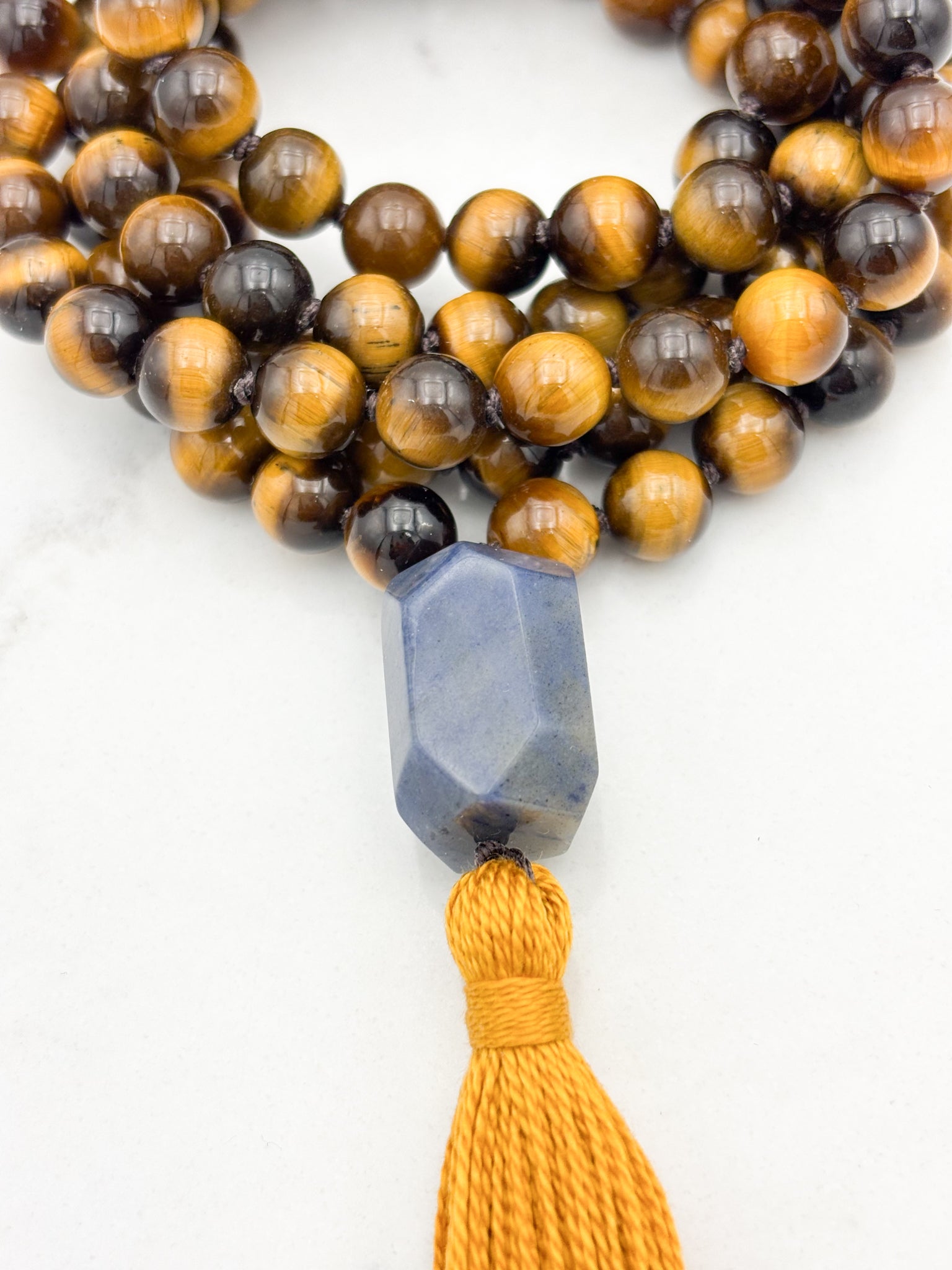 tiger's eye gemstone mala with blue quartz guru bead and gold tassel | radiant malas | handmade in boulder, colorado