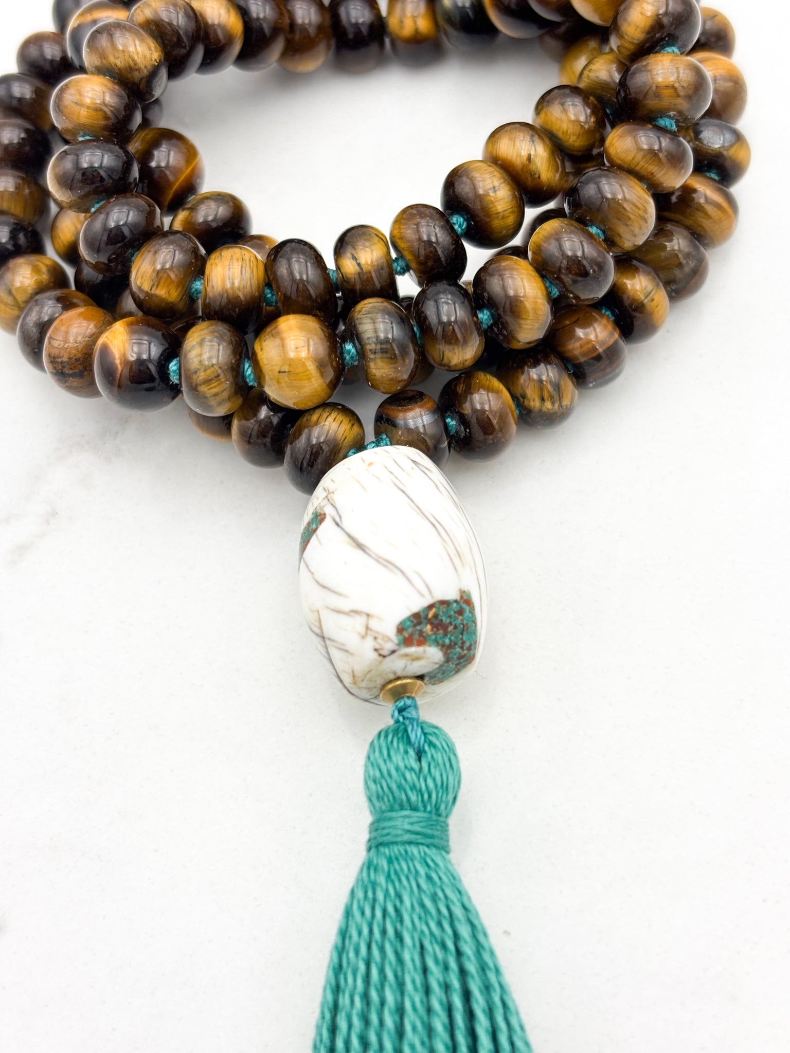tiger's eye gemstone mala with bone guru bead and green tassel | radiant malas | handmade in boulder, colorado