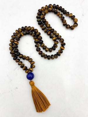 tiger's eye gemstone mala with lapis guru bead and gold tassel | radiant malas | handmade in boulder, colorado