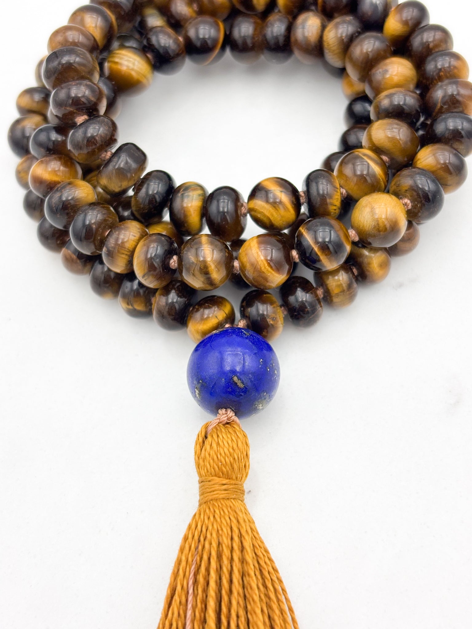 tiger's eye gemstone mala with lapis guru bead and gold tassel | radiant malas | handmade in boulder, colorado