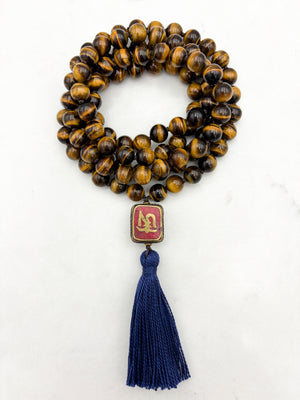 tiger's eye gemstone mala with vintage tibetan guru bead and navy tassel| radiant malas | handmade in boulder, colorado