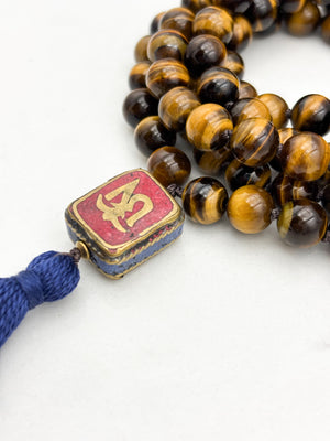 tiger's eye gemstone mala with vintage tibetan guru bead and navy tassel| radiant malas | handmade in boulder, colorado