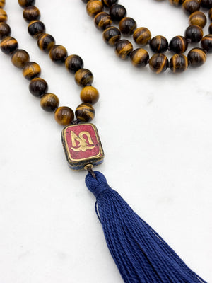 tiger's eye gemstone mala with vintage tibetan guru bead and navy tassel| radiant malas | handmade in boulder, colorado
