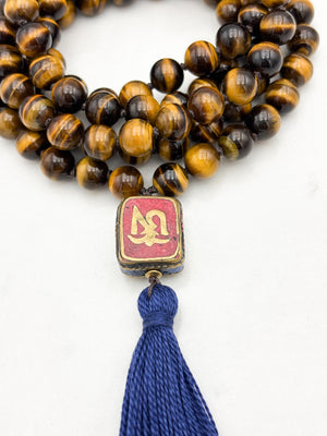 tiger's eye gemstone mala with vintage tibetan guru bead and navy tassel| radiant malas | handmade in boulder, colorado