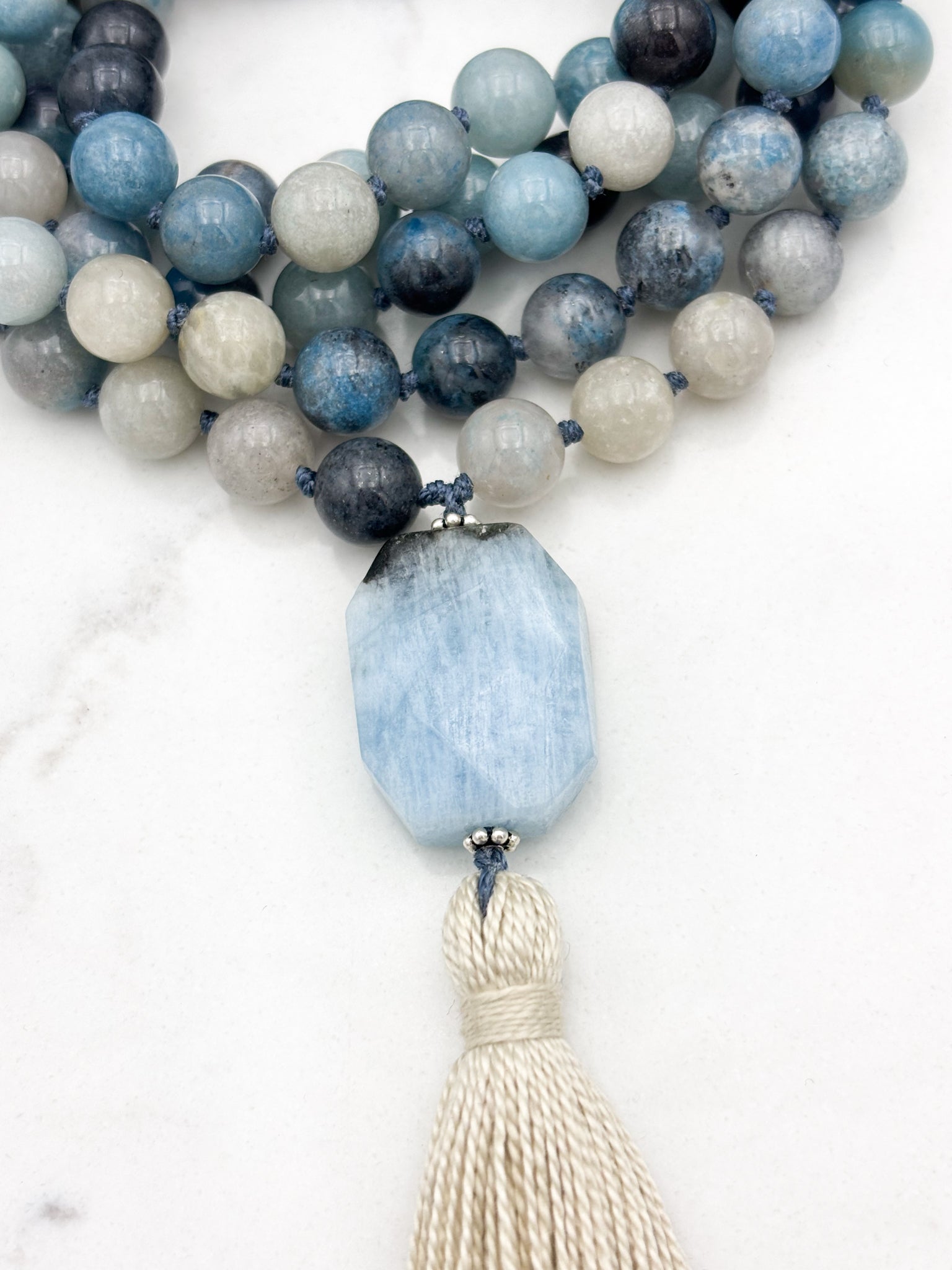 trolleite gemstone mala necklace with aquamarine guru bead and cream tassel | radiant malas | handmade in boulder, colorado
