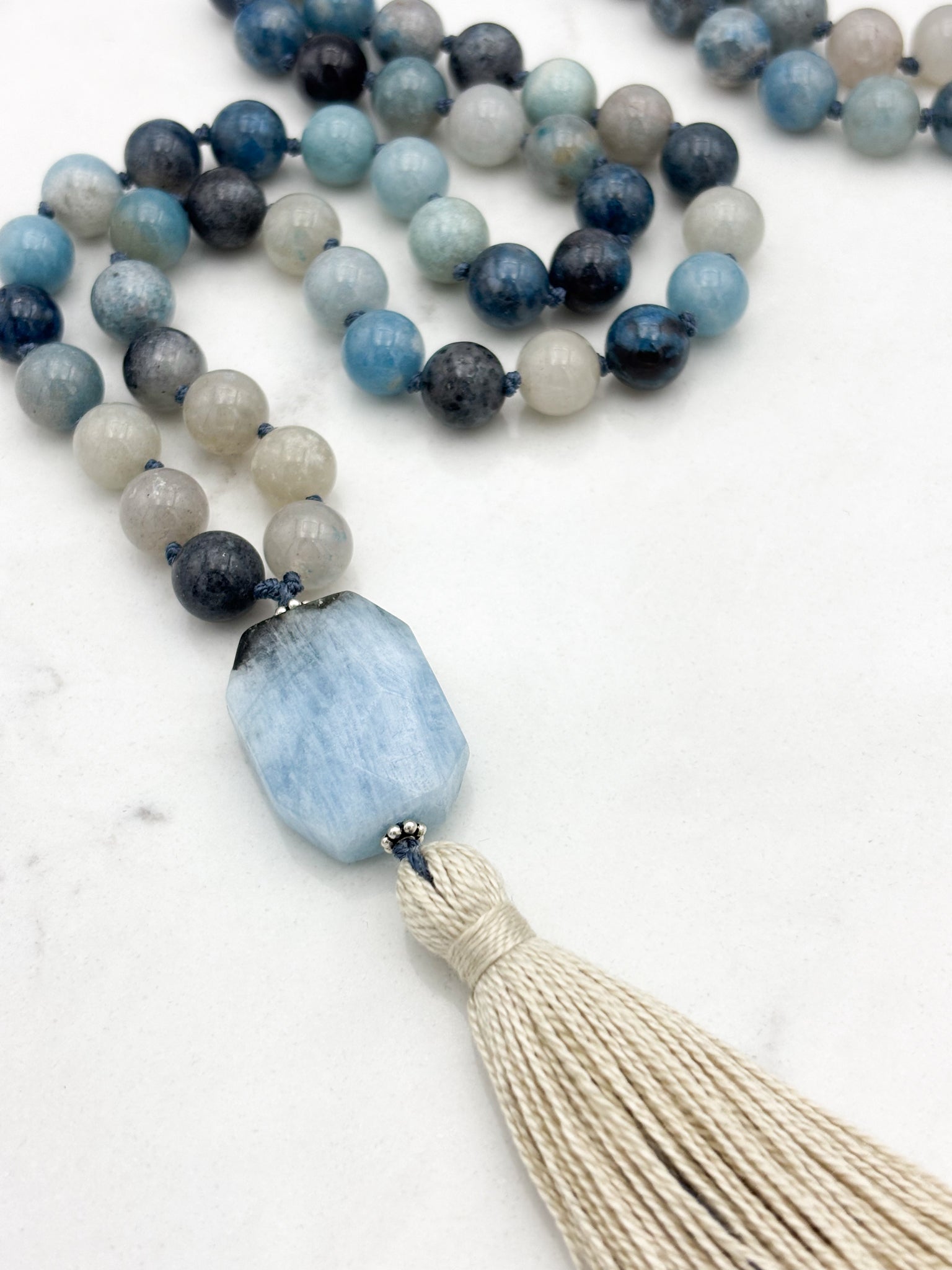 trolleite gemstone mala necklace with aquamarine guru bead and cream tassel | radiant malas | handmade in boulder, colorado