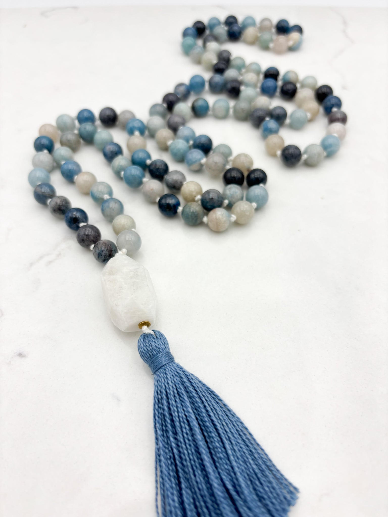 trolleite gemstone mala necklace with moonstone guru bead and blue tassel | radiant malas | handmade in boulder, colorado