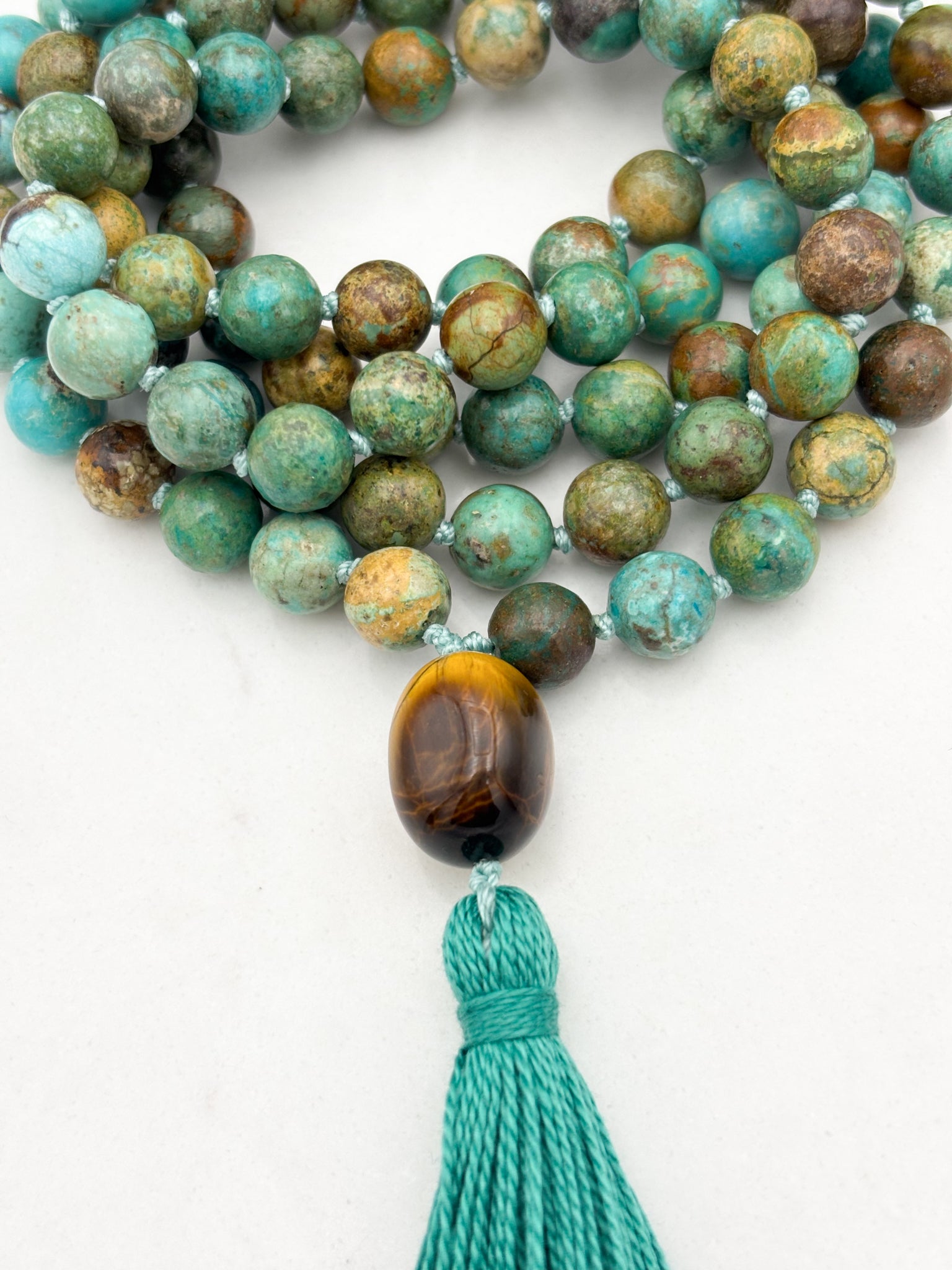 turquoise gemstone mala wiith tiger's eye guru bead and turquoise tassel | radiant malas | handmade in boulder, colorado