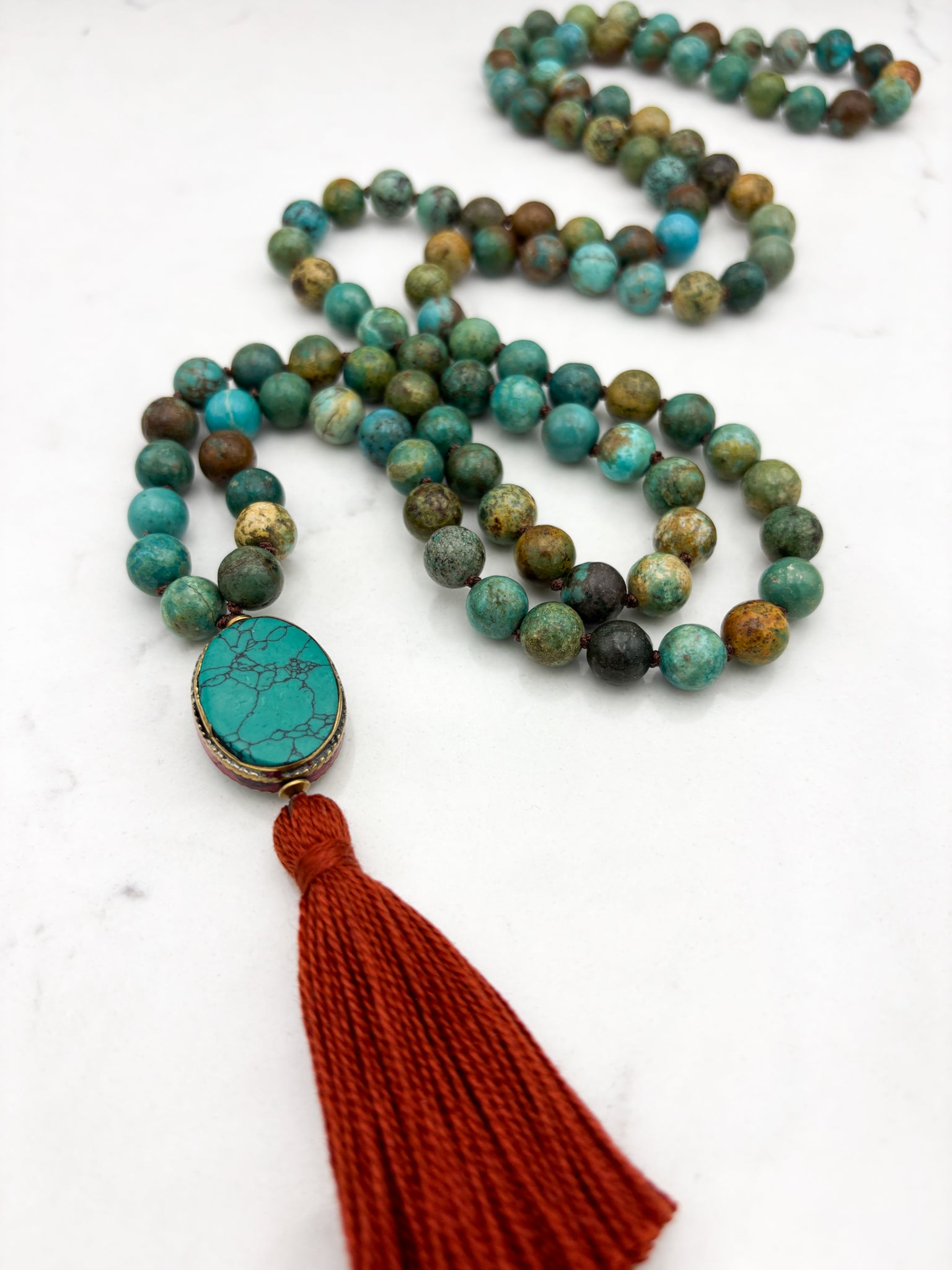 turquoise gemstone mala with turquoise guru bead and rust tassel | radiant malas | handmade in boulder, colorado																		