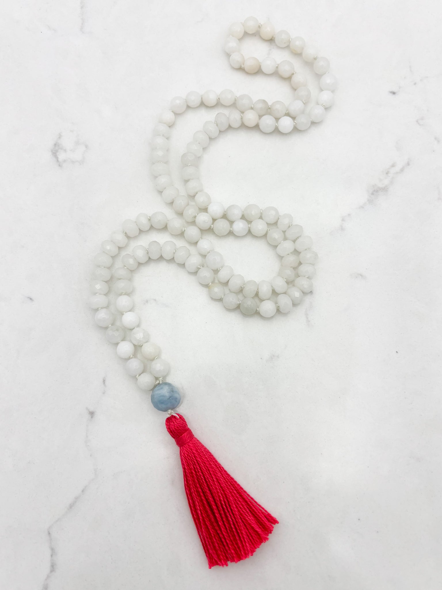 white jade gemstone mala necklace with aquamarine guru bead and pink tassel | radiant malas | handmade in boulder, colorado