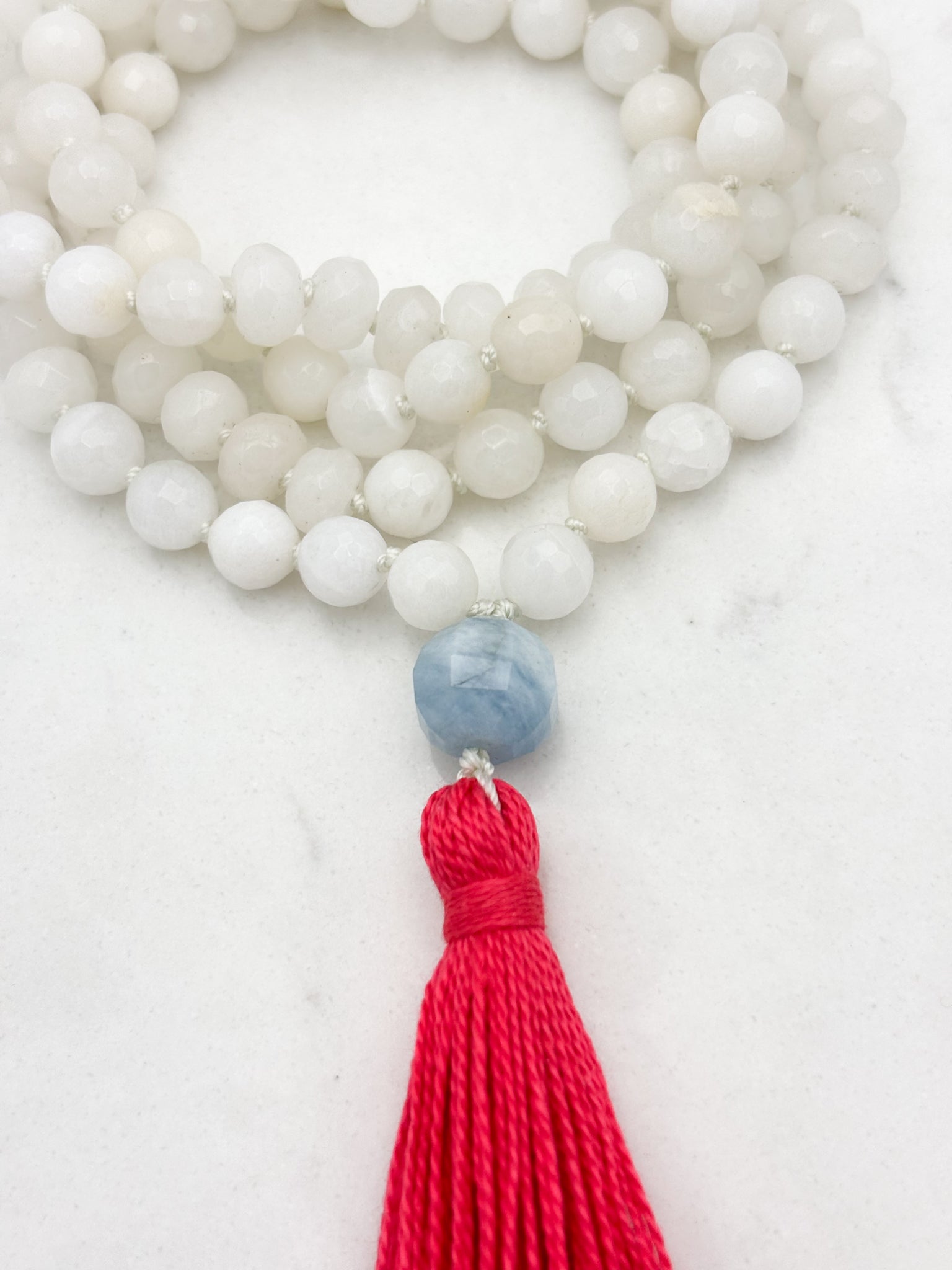 white jade gemstone mala necklace with aquamarine guru bead and pink tassel | radiant malas | handmade in boulder, colorado