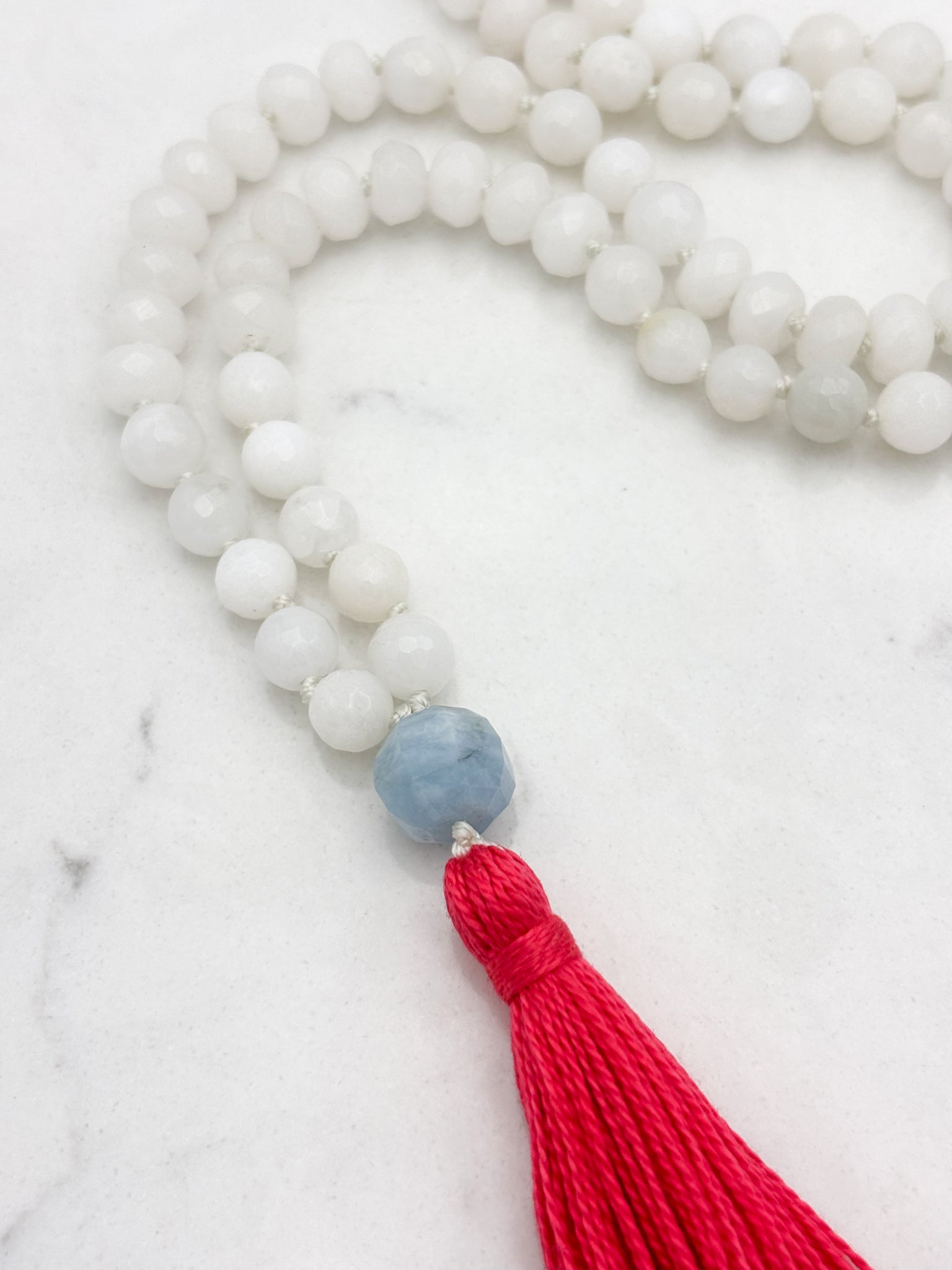 white jade gemstone mala necklace with aquamarine guru bead and pink tassel | radiant malas | handmade in boulder, colorado