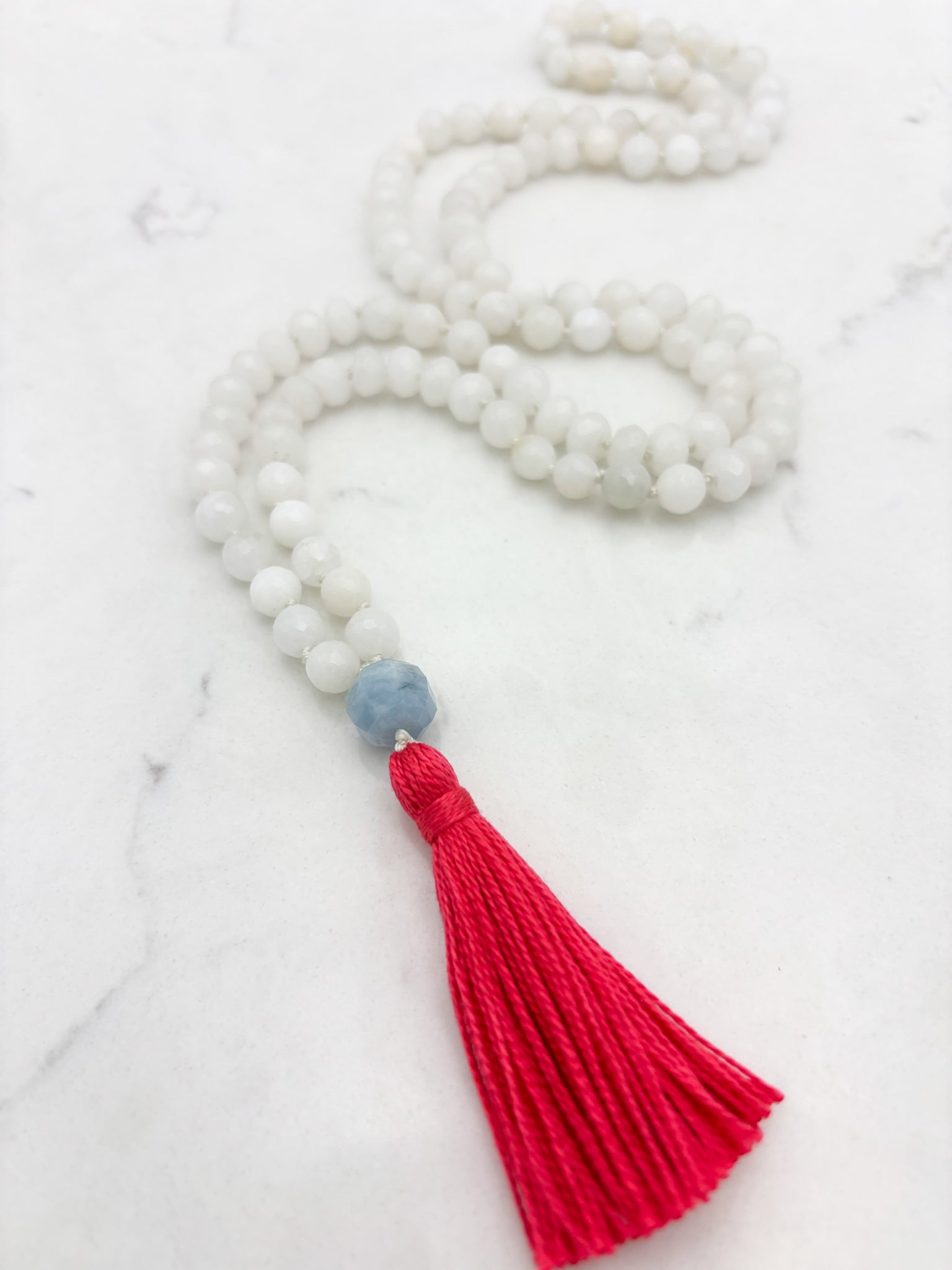white jade gemstone mala necklace with aquamarine guru bead and pink tassel | radiant malas | handmade in boulder, colorado