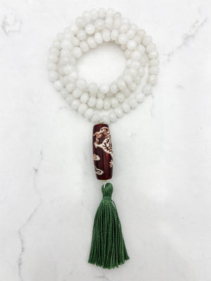 white jade gemstone mala necklace with wood/dragon guru bead and green tassel | radiant malas | handmade in boulder, colorado