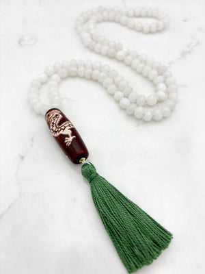 white jade gemstone mala necklace with wood/dragon guru bead and green tassel | radiant malas | handmade in boulder, colorado