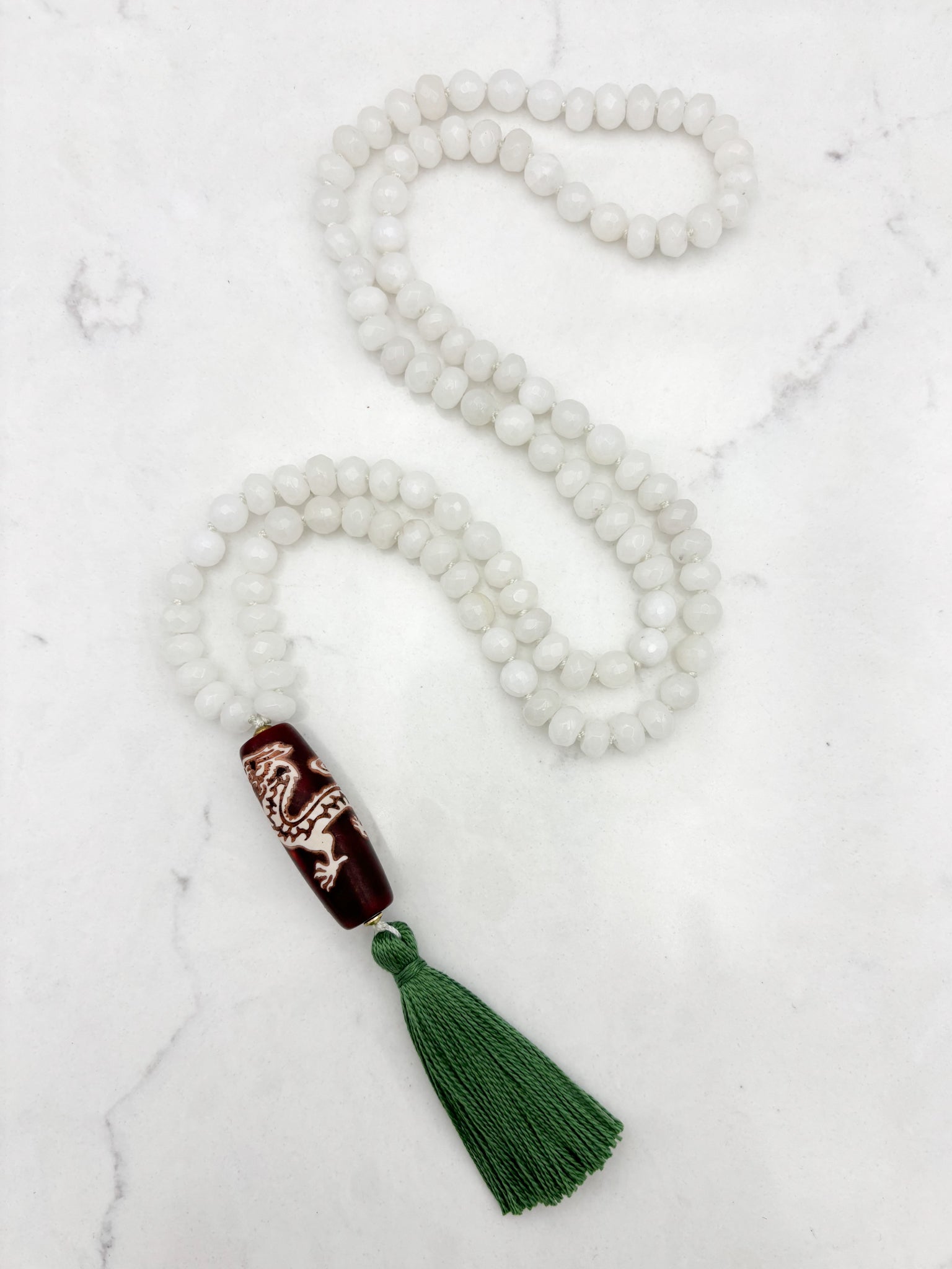 white jade gemstone mala necklace with wood/dragon guru bead and green tassel | radiant malas | handmade in boulder, colorado
