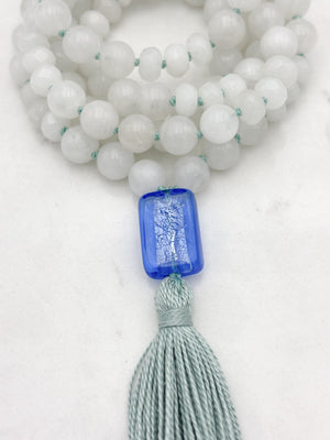 white jade gemstone mala necklace with blue lampwork glass guru bead and seafoam green tassel | radiant malas | handmade in boulder, colorado