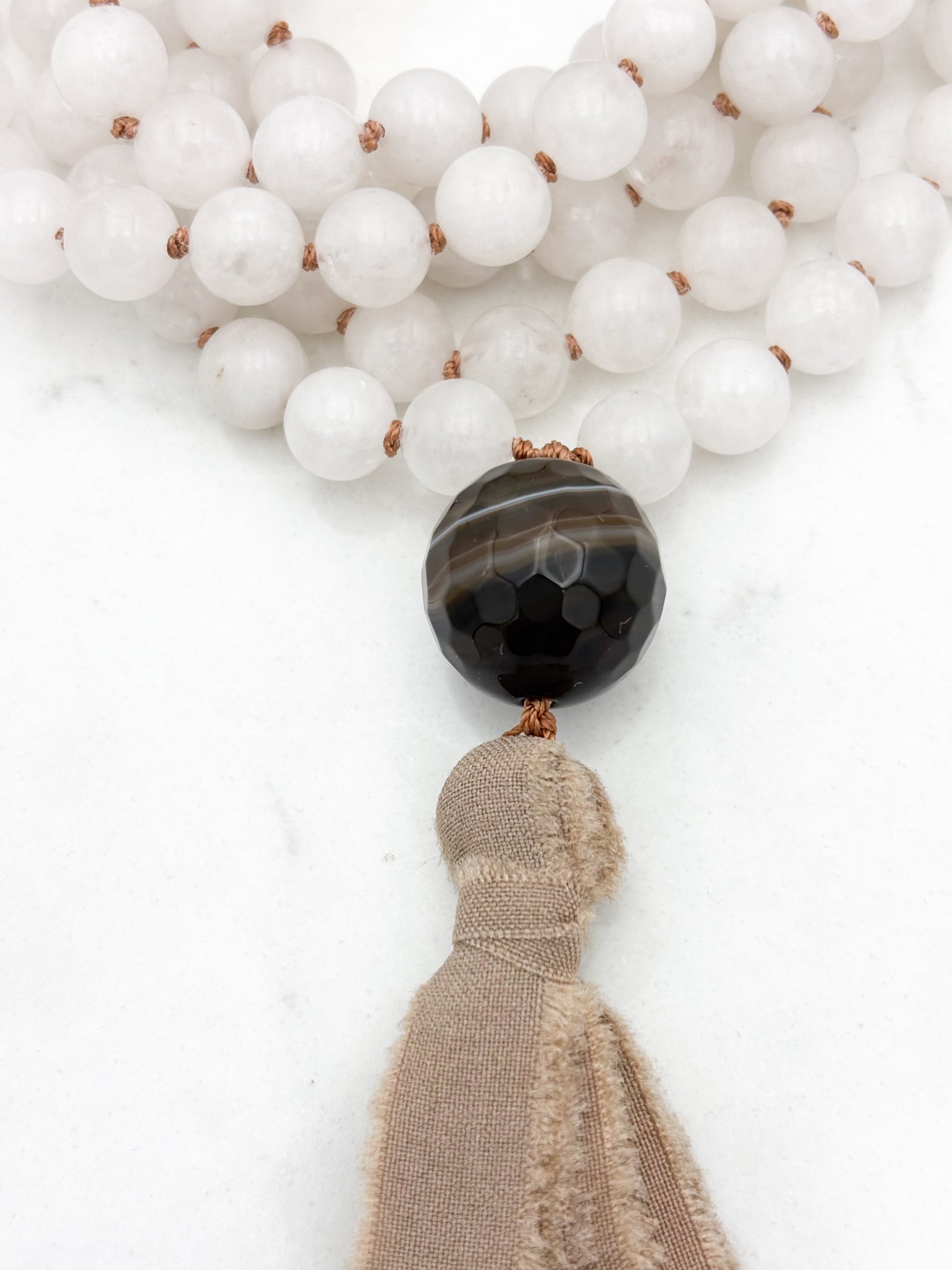 white jade gemstone mala necklace with sardonyx guru bead and silk tassel | radiant malas | handmade in boulder, colorado