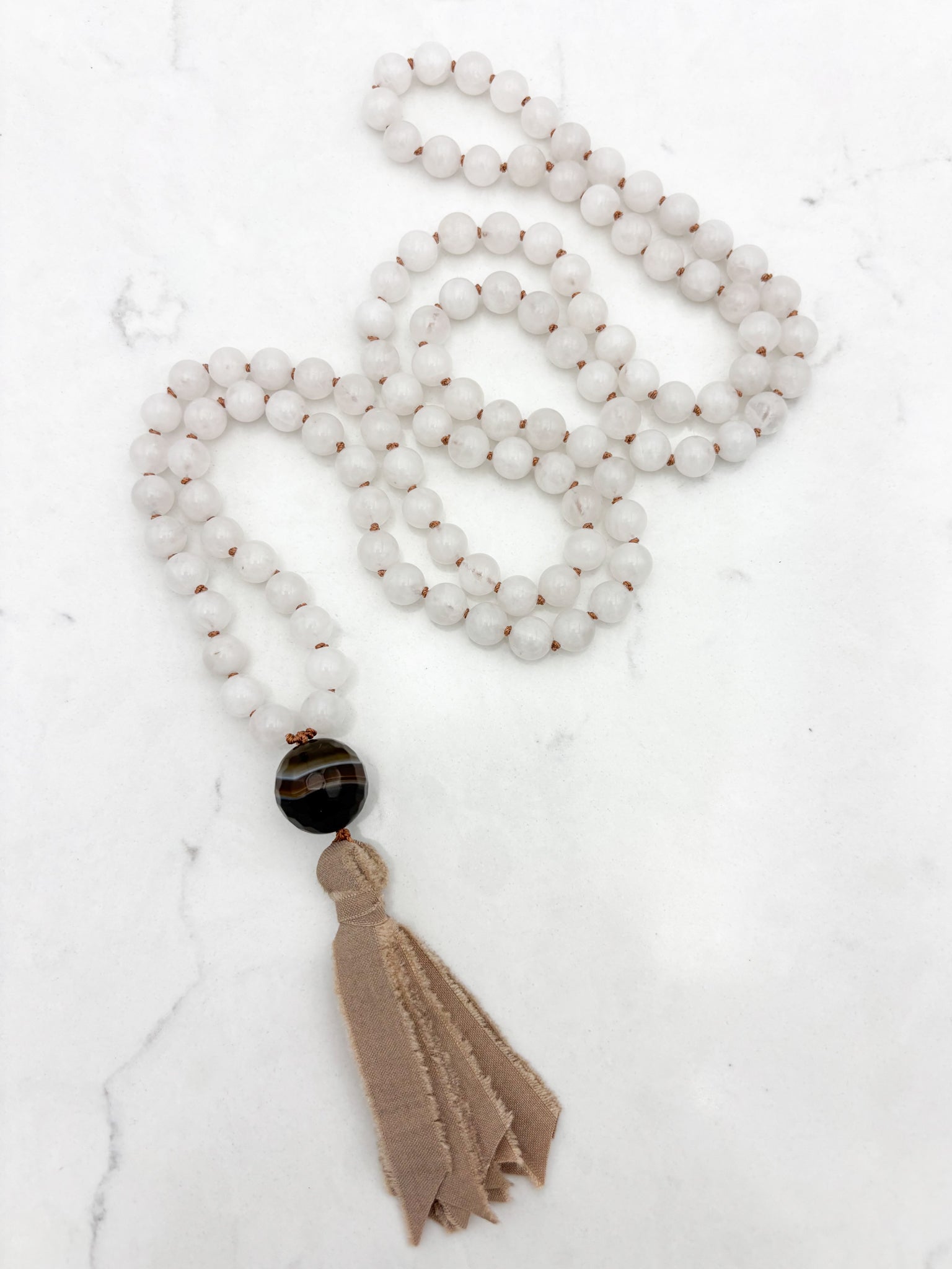 white jade gemstone mala necklace with sardonyx guru bead and silk tassel | radiant malas | handmade in boulder, colorado