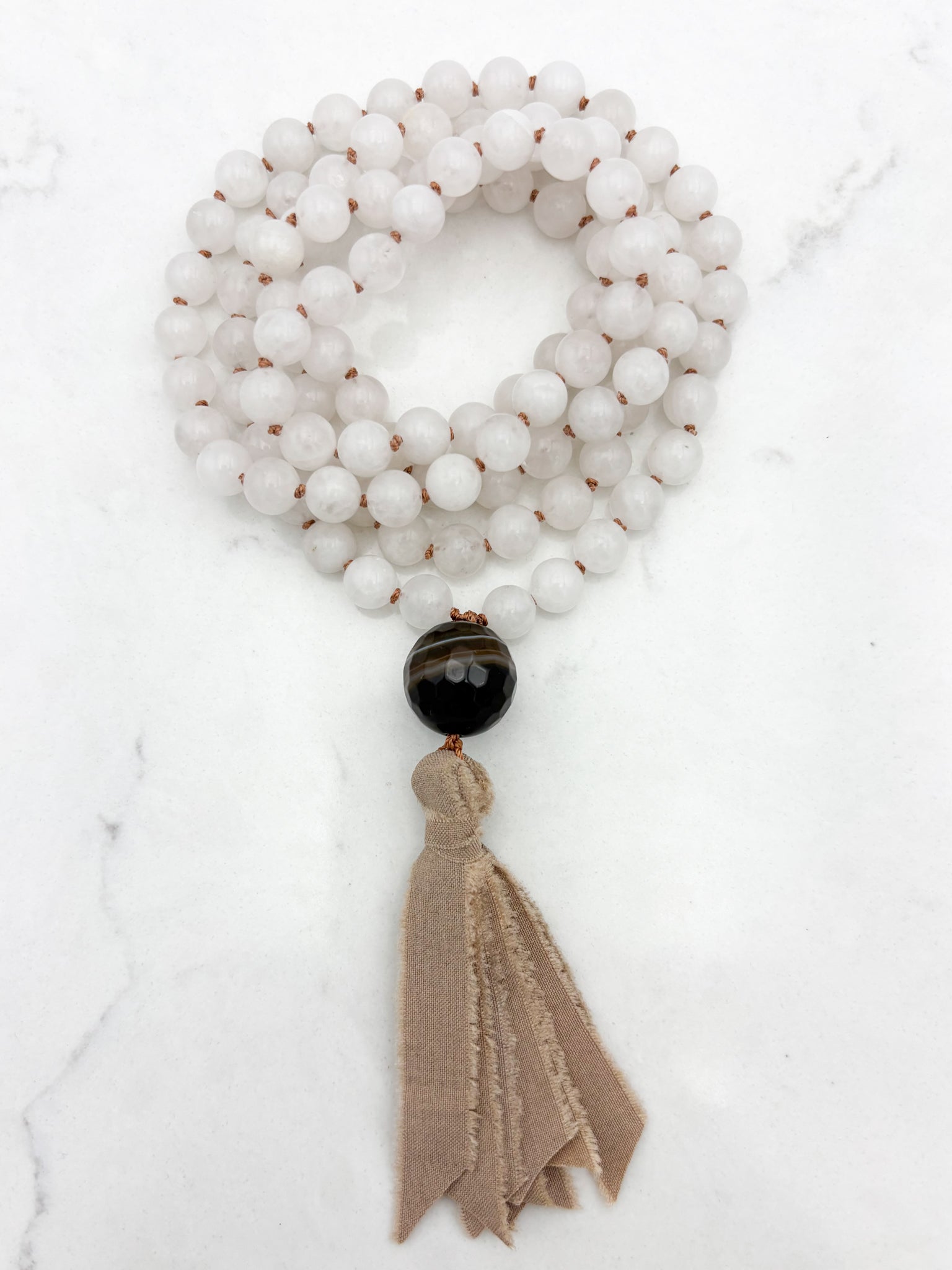 white jade gemstone mala necklace with sardonyx guru bead and silk tassel | radiant malas | handmade in boulder, colorado