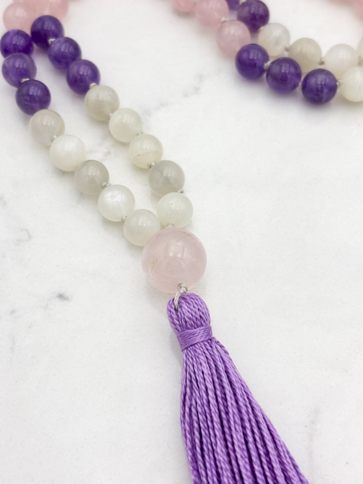 wisdom gemstone mala necklace with rose quartz, amethyst and moonstone beads, rose quartz guru bead and lilac tassel | radiant malas | handmade in boulder, colorado
