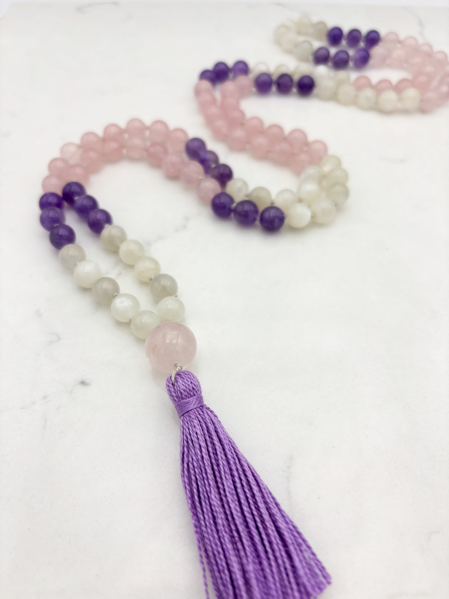 wisdom gemstone mala necklace with rose quartz, amethyst and moonstone beads, rose quartz guru bead and lilac tassel | radiant malas | handmade in boulder, colorado