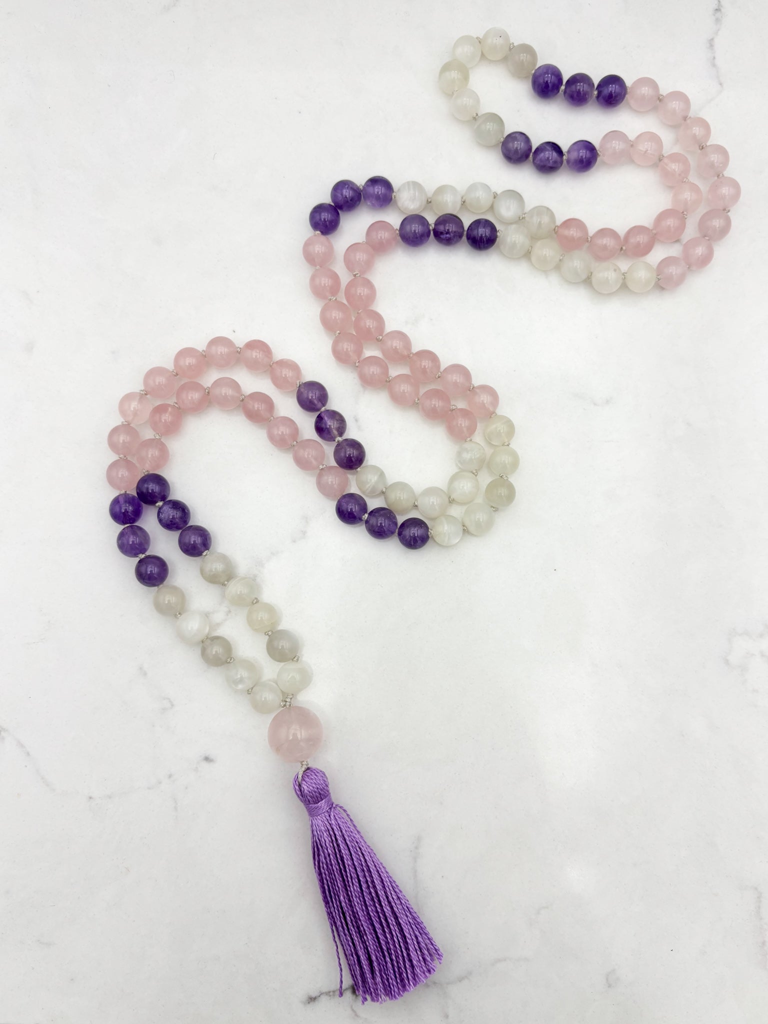 wisdom gemstone mala necklace with rose quartz, amethyst and moonstone beads, rose quartz guru bead and lilac tassel | radiant malas | handmade in boulder, colorado