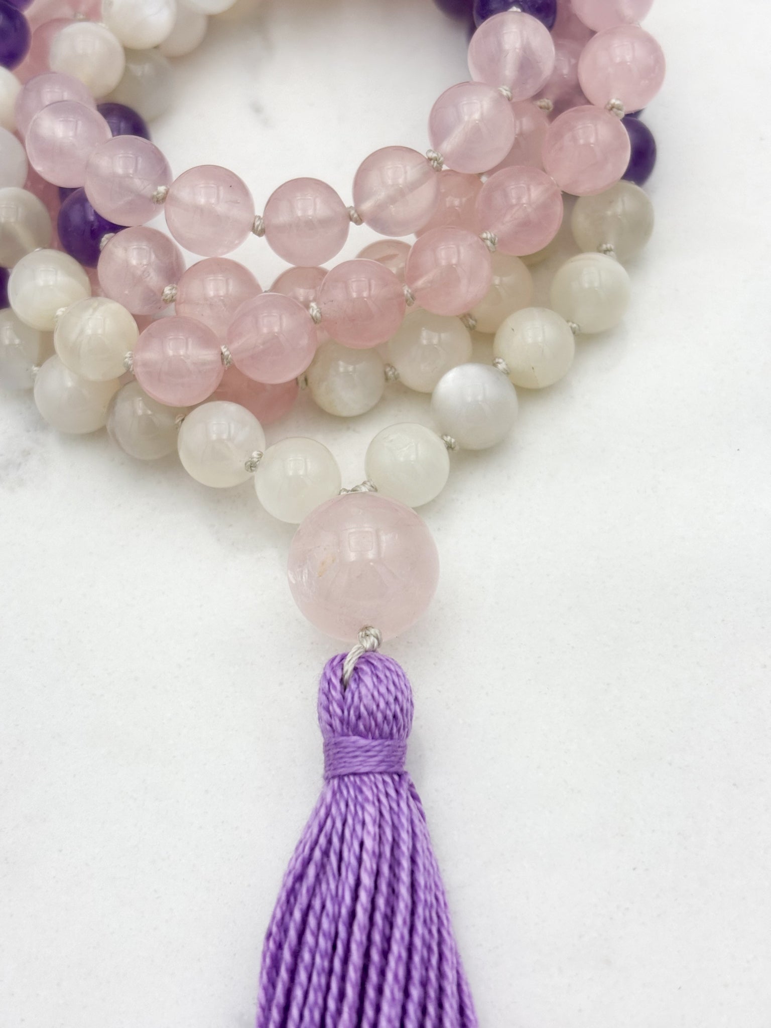 wisdom gemstone mala necklace with rose quartz, amethyst and moonstone beads, rose quartz guru bead and lilac tassel | radiant malas | handmade in boulder, colorado