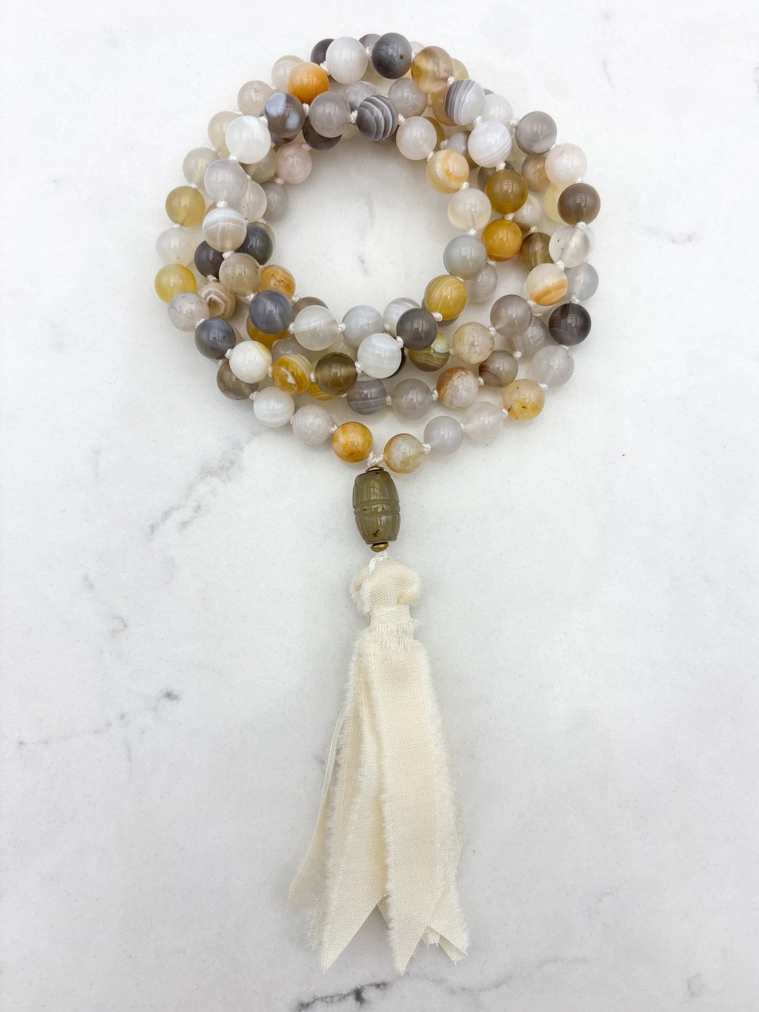 yellow botswana agate gemstone mala with carnelian guru bead and cream silk tassel | radiant malas | handmade in boulder, colorado