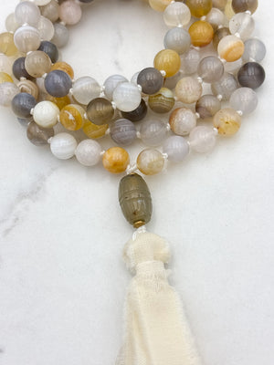 yellow botswana agate gemstone mala with carnelian guru bead and cream silk tassel | radiant malas | handmade in boulder, colorado