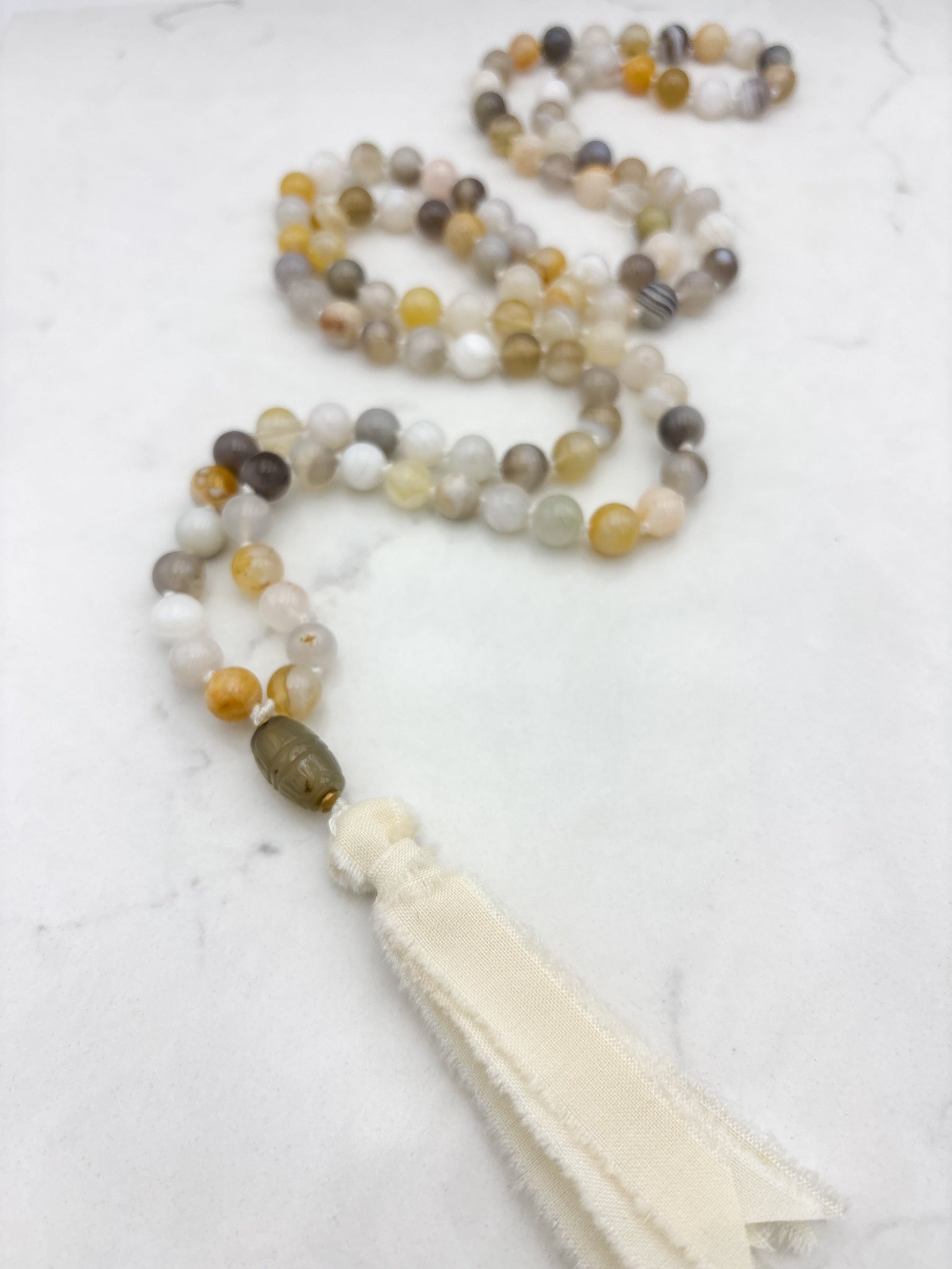 yellow botswana agate gemstone mala with carnelian guru bead and cream silk tassel | radiant malas | handmade in boulder, colorado