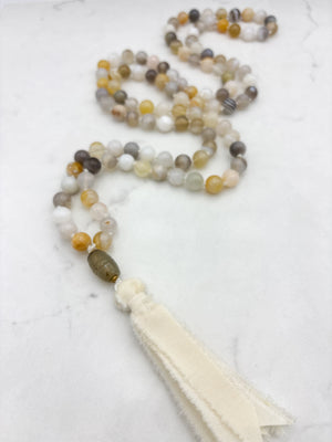 yellow botswana agate gemstone mala with carnelian guru bead and cream silk tassel | radiant malas | handmade in boulder, colorado